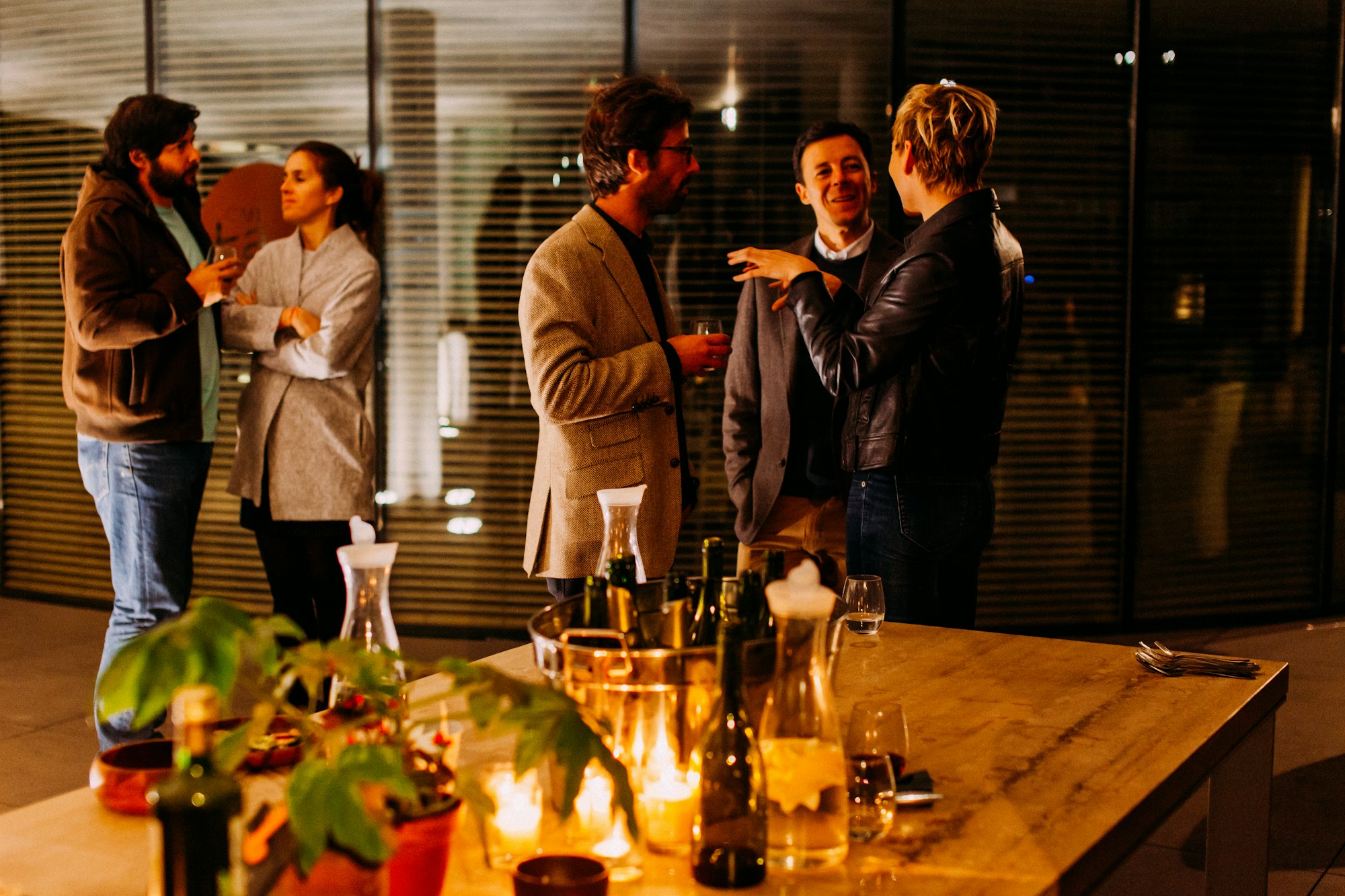 People networking at a happy hour event